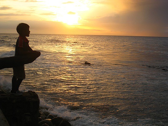 a-boy-looking-out-to-sea